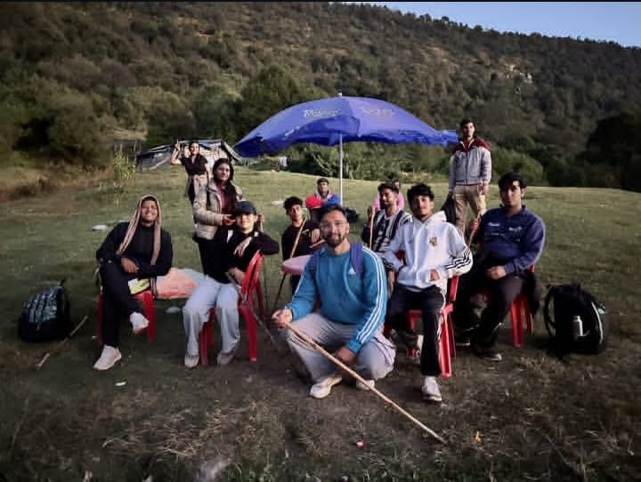 Group relaxing at an evening camp