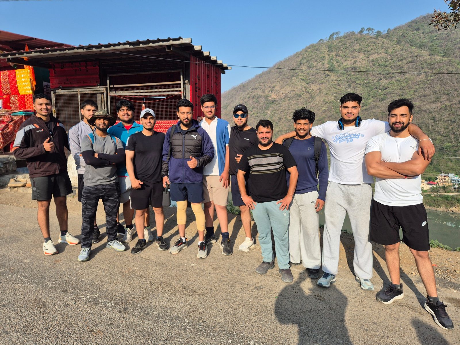 Group photo on the road beside a river