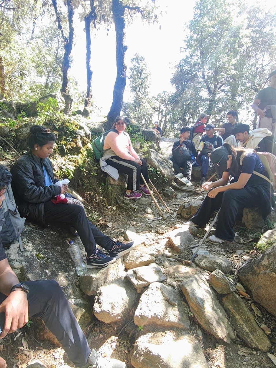 Group resting on rocks along the trail